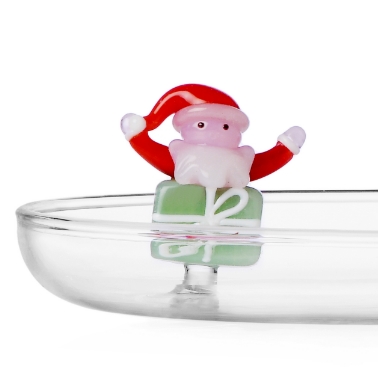 Weihnachtsmann auf grünem Geschenk